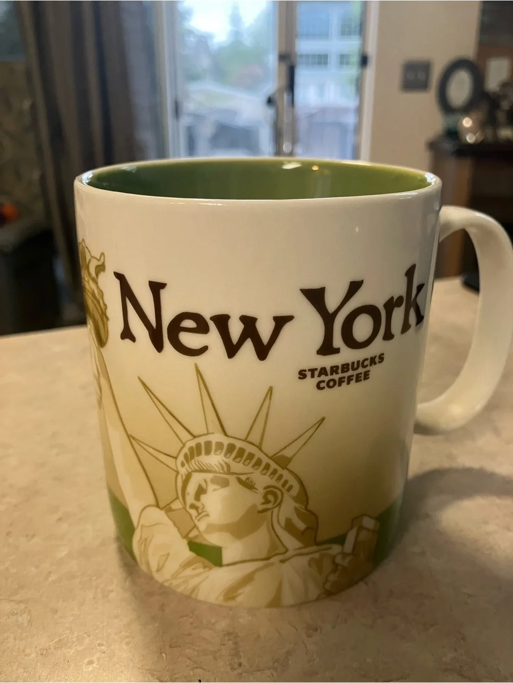 Starbucks White Mug with Green Interior and Green Alaska Lettering